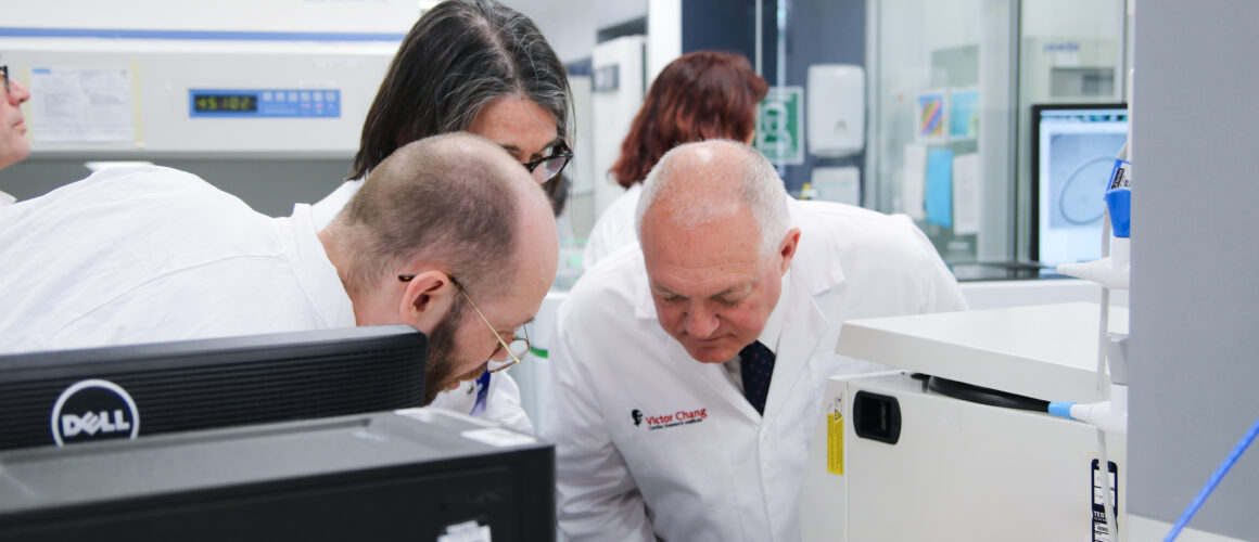 Minister David Harris studies a non-animal technology at the Victor Change Research Institute